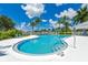 Relaxing kidney-shaped community pool with lounge chairs at 5201 Highbury Cir, Sarasota, FL 34238