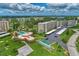 Aerial view of building complex with pool and parking at 3820 Ironwood Ln # 603I, Bradenton, FL 34209