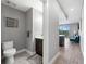 Bathroom featuring a toilet and vanity with a sink and mirror at 1703 N Tamiami Trl # 302, Sarasota, FL 34234
