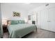 Bedroom with large bed, and ensuite bathroom access at 1703 N Tamiami Trl # 302, Sarasota, FL 34234
