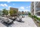 Inviting common area with fire pit and comfortable seating, perfect for socializing and enjoying the outdoors at 1703 N Tamiami Trl # 302, Sarasota, FL 34234