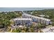 An exterior view of the condo community, with coastal views and parking at 1703 N Tamiami Trl # 302, Sarasota, FL 34234