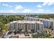An exterior view of the condo community, with coastal views and parking at 1703 N Tamiami Trl # 302, Sarasota, FL 34234