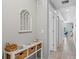 Hallway featuring decor elements and leading into a room with neutral walls at 1703 N Tamiami Trl # 302, Sarasota, FL 34234