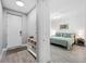 Hallway view to the front door and to the bedroom at 1703 N Tamiami Trl # 302, Sarasota, FL 34234