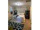 Bedroom with a comfy queen size bed, two shelving units, and a bright window at 3375 8Th St, Sarasota, FL 34237