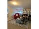 Well-organized closet with shelving for shoes and accessories, complemented by a red chair and bright window at 3375 8Th St, Sarasota, FL 34237