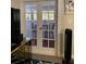 Living area leading to a patio, with views of outdoor seating through glass doors at 3375 8Th St, Sarasota, FL 34237
