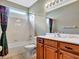 Bathroom with a bathtub, toilet, single vanity and a window view at 4145 Reflections Pkwy, Sarasota, FL 34233