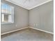 Bedroom with carpeted floor, a window view, and a ceiling fan at 4145 Reflections Pkwy, Sarasota, FL 34233