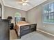 Bedroom with carpeted floor, a window view, and modern furnishings at 4145 Reflections Pkwy, Sarasota, FL 34233