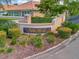 Villa Rosa community sign surrounded by manicured landscaping and flowers at 4145 Reflections Pkwy, Sarasota, FL 34233