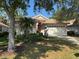 Charming single-story home with mature landscaping and an attached two-car garage at 4145 Reflections Pkwy, Sarasota, FL 34233