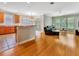 Inviting living room seamlessly connected to the kitchen, featuring hardwood floors and natural light at 4145 Reflections Pkwy, Sarasota, FL 34233