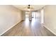Living area with wood-look floors and ceiling fan at 505 30Th W Ave # E304, Bradenton, FL 34205