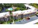 Aerial view of condo building near pool and pond at 505 30Th W Ave # E304, Bradenton, FL 34205