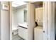 Small bathroom with stackable washer and dryer at 505 30Th W Ave # E304, Bradenton, FL 34205