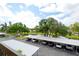 Covered parking area with views of pond and landscaping at 505 30Th W Ave # E304, Bradenton, FL 34205