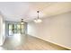 Spacious living room with wood-look flooring and sliding glass doors at 505 30Th W Ave # E304, Bradenton, FL 34205