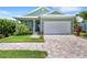 One-story house with a two-car garage at 18050 Wooden Skiff Ct, Nokomis, FL 34275