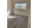 Simple bedroom with grey vinyl flooring at 3375 8Th St, Sarasota, FL 34237