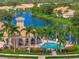 Community pool with a clubhouse and surrounding palm trees at 4145 Reflections Pkwy, Sarasota, FL 34233