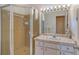 Clean bathroom with a shower and white vanity at 8911 Midnight Pass Rd # 410, Sarasota, FL 34242