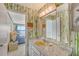 Bathroom with a sink, vanity, and view of a bedroom at 8911 Midnight Pass Rd # 410, Sarasota, FL 34242
