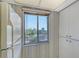 Kitchen with white cabinets, refrigerator and a view from the window at 8911 Midnight Pass Rd # 410, Sarasota, FL 34242