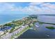 Aerial view showcasing condo, beach, and waterways at 8911 Midnight Pass Rd # 410, Sarasota, FL 34242