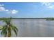 Scenic water view with palm trees and blue skies at 8911 Midnight Pass Rd # 410, Sarasota, FL 34242