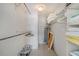 Large walk-in closet with shelving and hanging rods at 8911 Midnight Pass Rd # 410, Sarasota, FL 34242