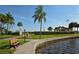 Relaxing community pool with patio furniture and waterfront views at 8911 Midnight Pass Rd # 410, Sarasota, FL 34242