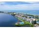 Aerial view of condo building near waterfront at 8911 Midnight Pass Rd # 410, Sarasota, FL 34242