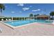 Large resort-style pool with plenty of lounge chairs at 8911 Midnight Pass Rd # 410, Sarasota, FL 34242