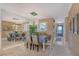 Bright dining area with mirrored wall and elegant chandelier at 8911 Midnight Pass Rd # 410, Sarasota, FL 34242