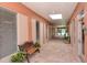 Community hallway with tiled floors and seating at 8911 Midnight Pass Rd # 410, Sarasota, FL 34242
