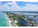 Aerial view of condo complex near beach and waterways at 8911 Midnight Pass Rd # 410, Sarasota, FL 34242