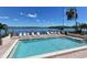 Enjoy this sparkling pool with water views and plenty of lounge chairs at 8911 Midnight Pass Rd # 410, Sarasota, FL 34242