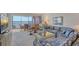 Spacious living room with water views and comfortable seating at 8911 Midnight Pass Rd # 410, Sarasota, FL 34242