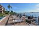 Relaxing waterfront patio with lounge chairs for residents at 8911 Midnight Pass Rd # 410, Sarasota, FL 34242