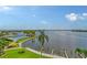 Stunning view of the community pool and marina with water access at 8911 Midnight Pass Rd # 410, Sarasota, FL 34242