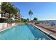 Inviting community pool area overlooking the water at 8911 Midnight Pass Rd # 410, Sarasota, FL 34242
