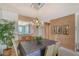 Bright dining room featuring a table for six and wood-paneled walls at 8911 Midnight Pass Rd # 410, Sarasota, FL 34242