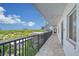 Building hallway with tiled floors and ocean views at 8911 Midnight Pass Rd # 410, Sarasota, FL 34242