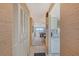 Bright entryway with built-in storage and view into living area at 8911 Midnight Pass Rd # 410, Sarasota, FL 34242