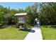 Walking path leading to park with information board at 8911 Midnight Pass Rd # 410, Sarasota, FL 34242