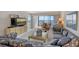 Spacious living room featuring water views and comfortable seating at 8911 Midnight Pass Rd # 410, Sarasota, FL 34242