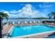 Community pool with waterfront views at 8911 Midnight Pass Rd # 410, Sarasota, FL 34242