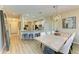 Farmhouse-style dining table with seating for six and kitchen access at 350 River Enclave Ct, Bradenton, FL 34212